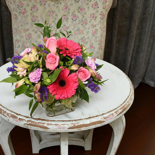 Flower arrangment in pink colours with roses and gerberas for Birthday celebration or get well. Same-day Burnaby and Vancouver Delivery.