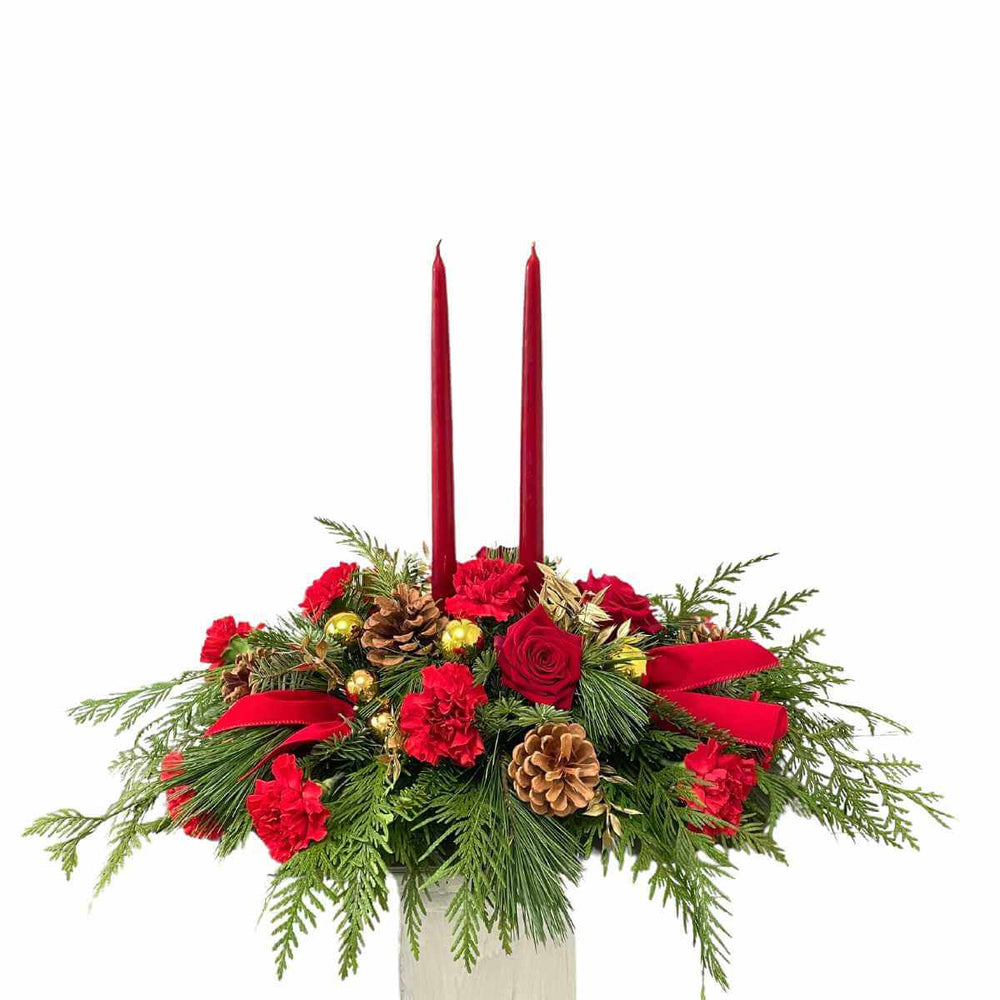 Christmas flower centerpiece with candles in Vancouver