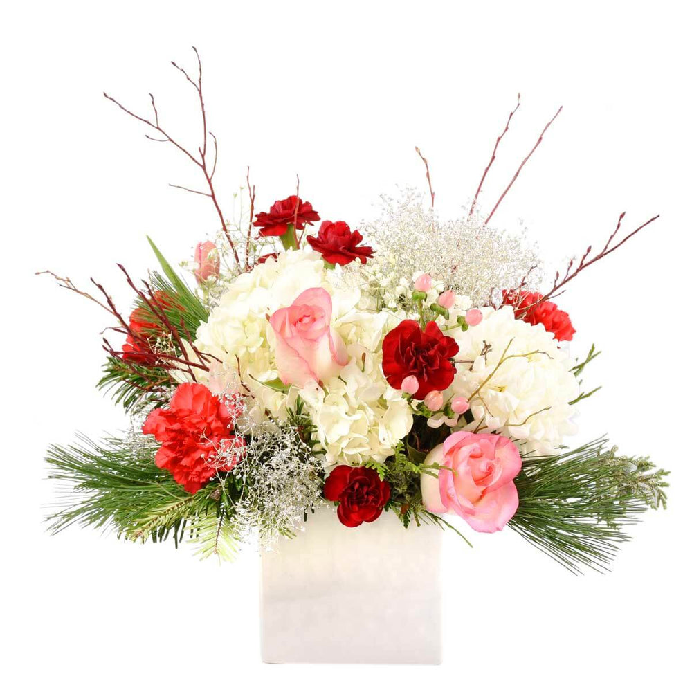 Christmas flower arrangement in ceramic cube for delivery