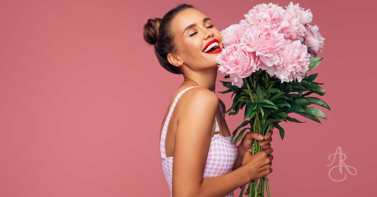 Woman holding a bouquet of fresh peonies from Burnaby Flower Shop Adele Rae Florists