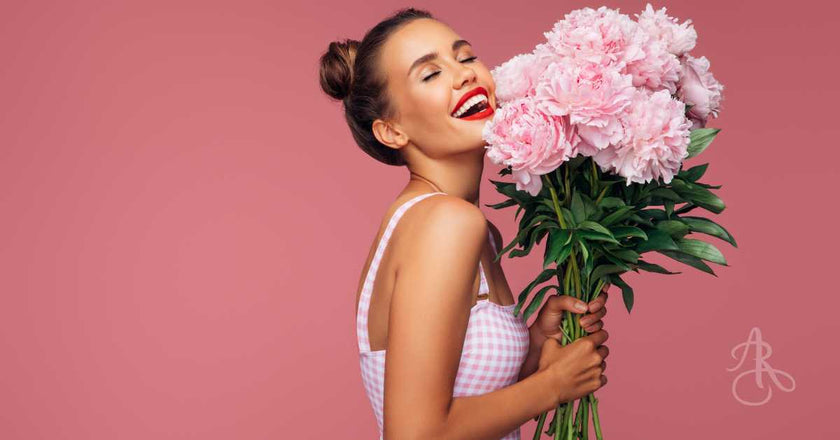 Woman holding a bouquet of fresh peonies from Burnaby Flower Shop Adele Rae Florists