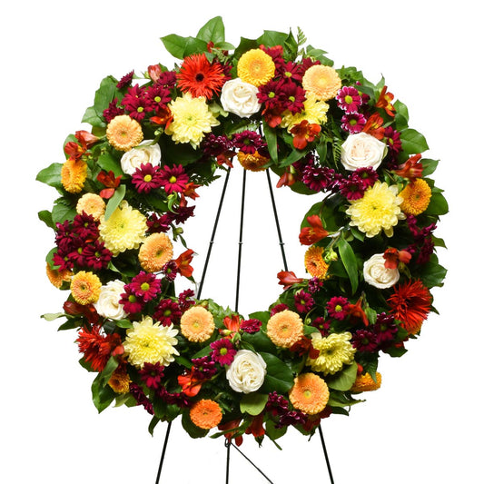 Funeral flower wreath in Vancouver with yellow, red and white flowers