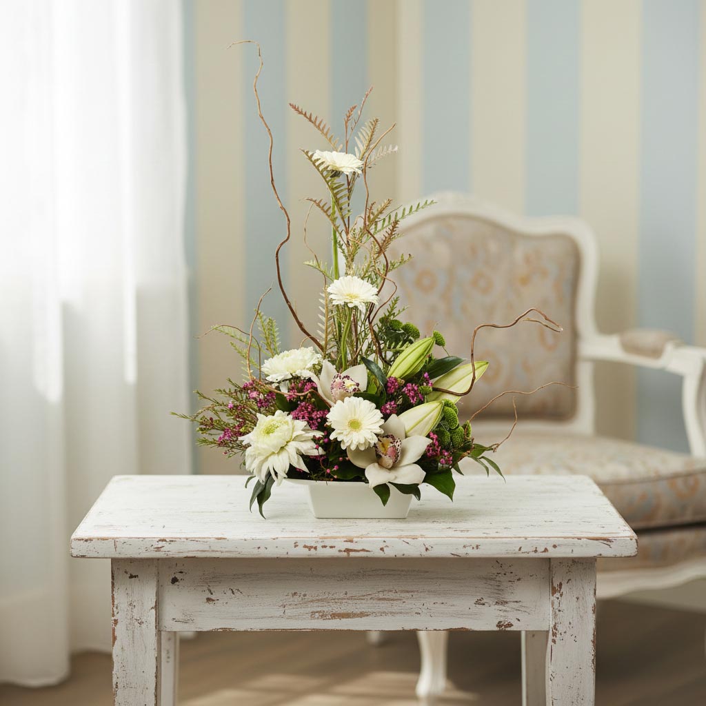 Sympathy flower arrangment with white flowers and garden style greenery for Burnaby BC Delivery