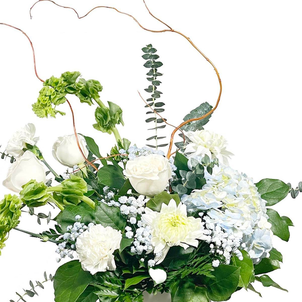 Elegant white flower sympathy arrangement for Surrey delivery by Adele Rae Florist