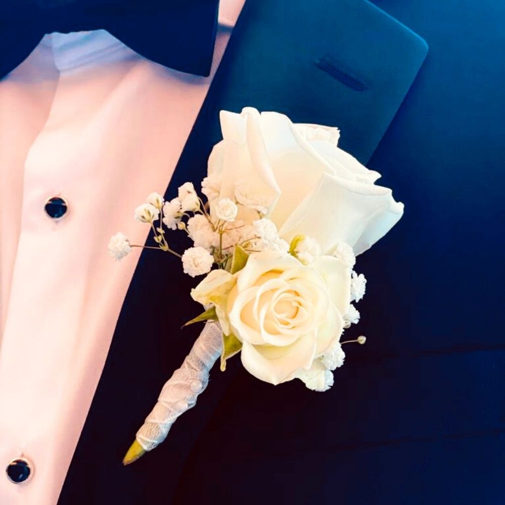 Wedding boutonniere with white roses from wedding florist Adele Rae