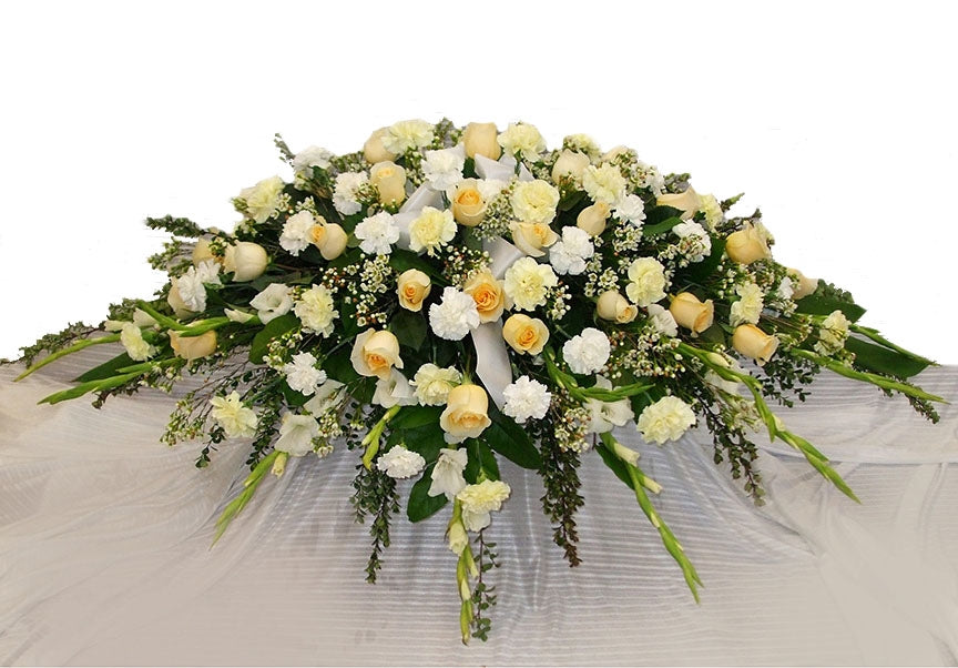Vancouver Funeral Flower Casket Spray with white and peach colour flowes | Adele Rae Florist | Burnaby Florist