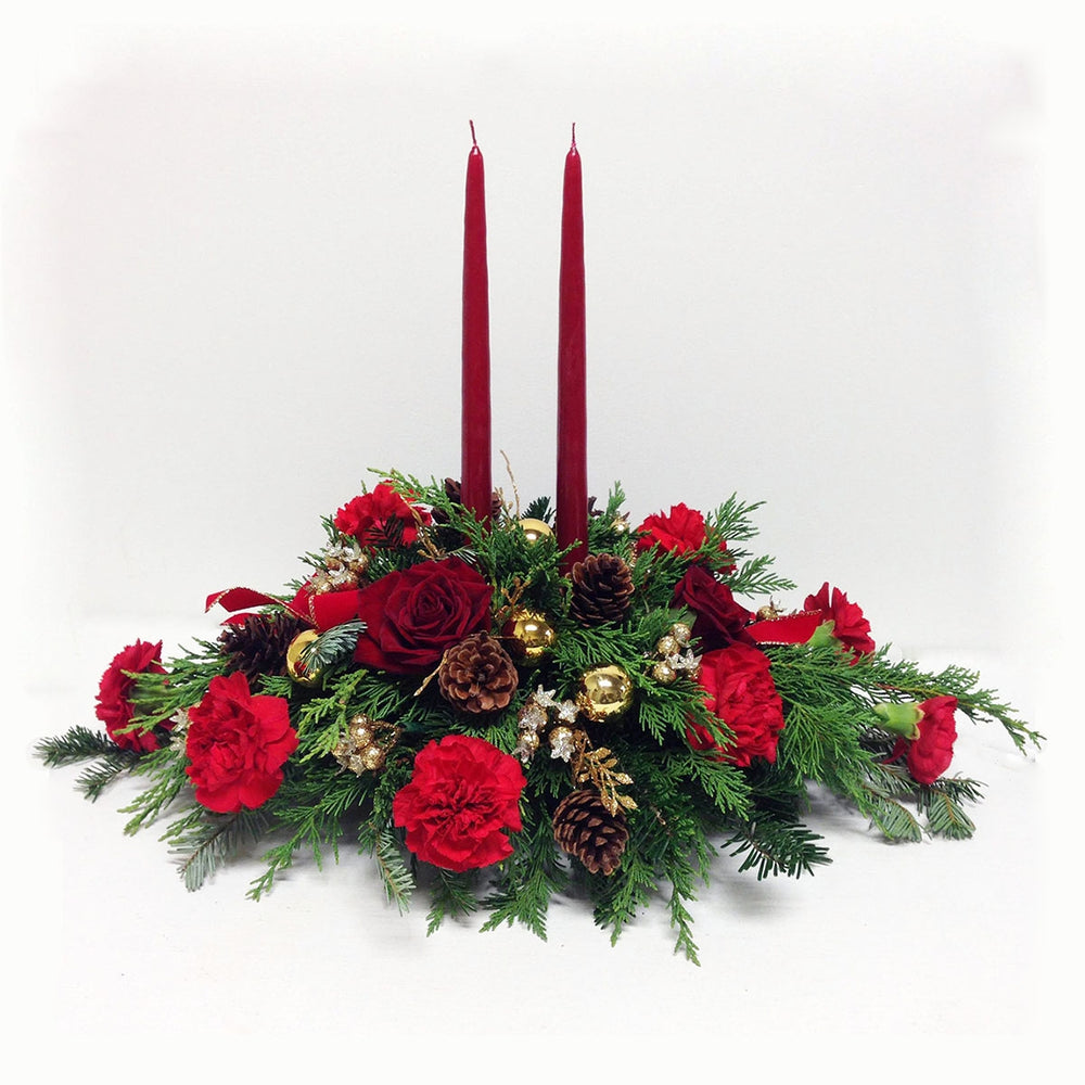 Beautiful Christmas centerpiece, includes red roses and two candles.