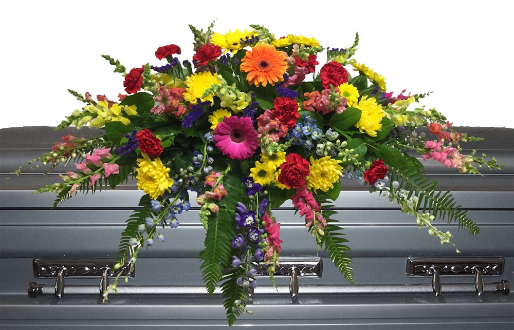 Funeral flower casket spray with assorted colourful flowrs