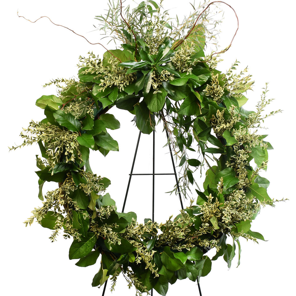 24 inch funeral wreath made with greeneries.